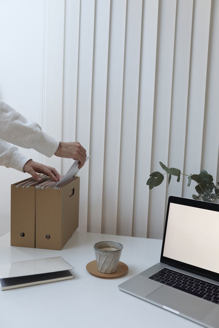 Crop person with documents in modern office